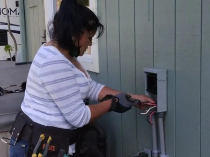 Licensed electrician wiring an exterior subpanel in Carter Lake