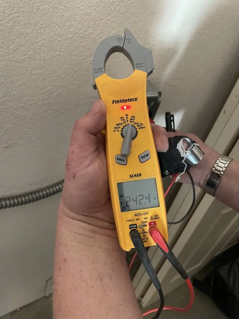 Voltage testing with clamp meter during Generator Installation in Carter Lake